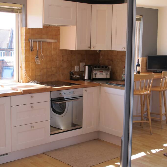 Part of kitchen showing oven and hob