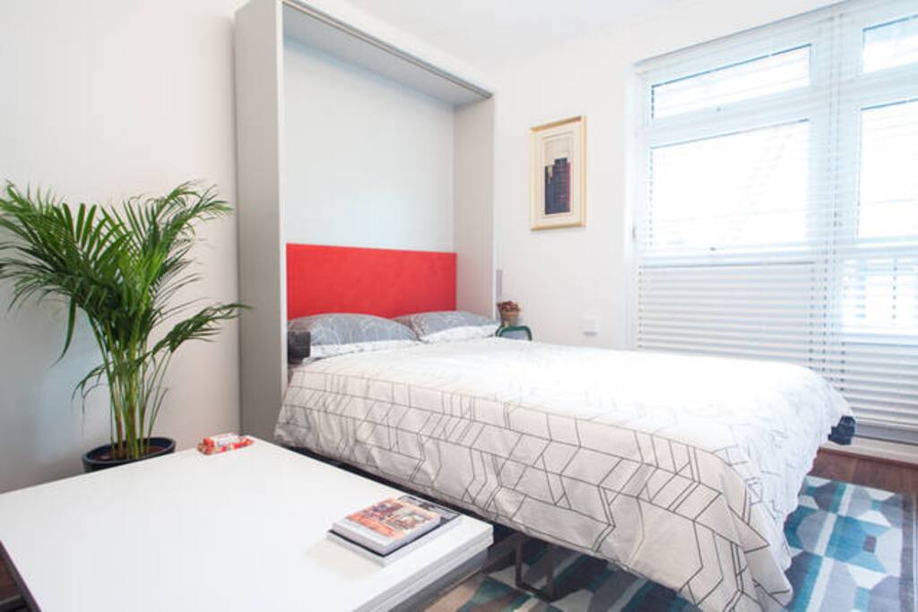 Wall bed lifts easily with one hand - no need to take off bedding!