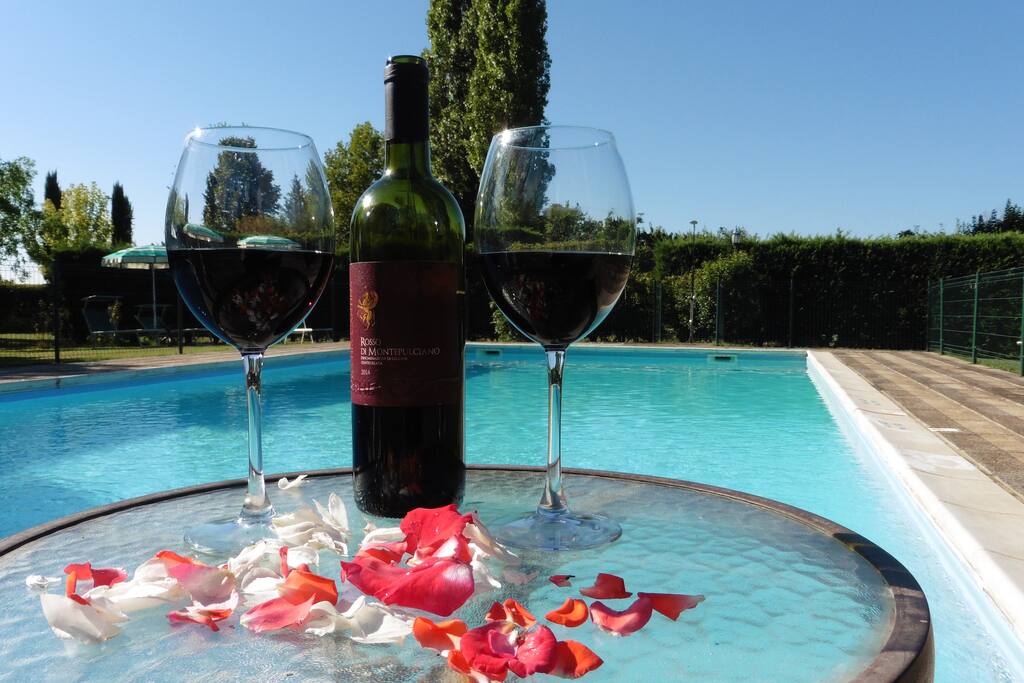 Glass of wine by the pool