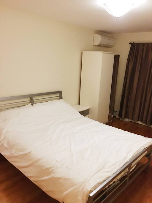 A comfortable queen size bed that has been washed and sanitized after every use.