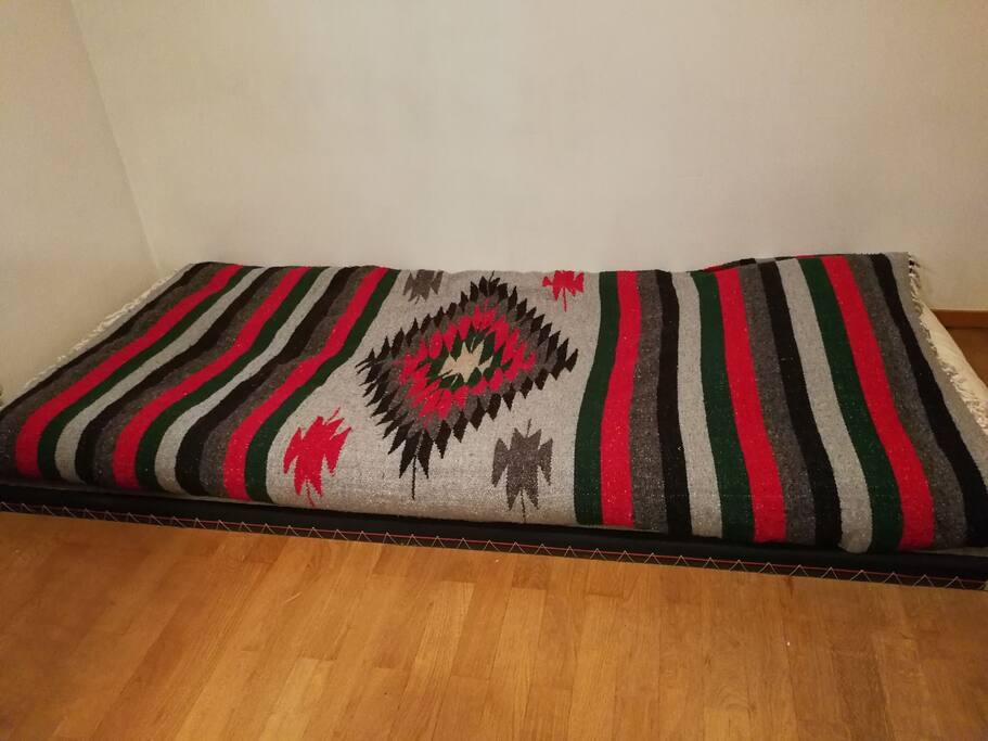The bed. Futon mattress on a tatami.