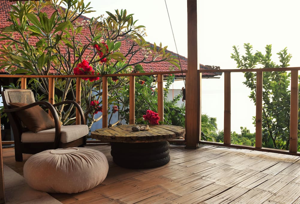 terrace with ocean view and garden view