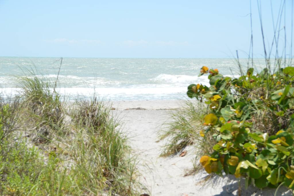 YOUR ENTRY TO THE BEACH ONLY 130 WALKING STEPS & ACROSS THE STREET IS THE BAY BOTH ARE DEEDED EASMENTS