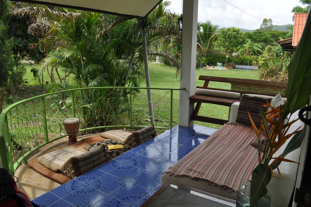 Outside Front Porch with comfy Couch and Roof and Stunning Views.