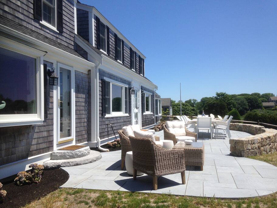Outdoor Stone Patio Overlooking Ocean Harbor, Dining Table, Conversation Set/Loveseat, 2 Chaise Lounges. Perfect for Entertaining!