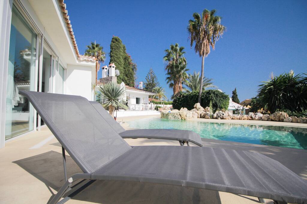 Sun-beds around our pool