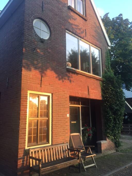 Front of the house. Entrance on side of the house