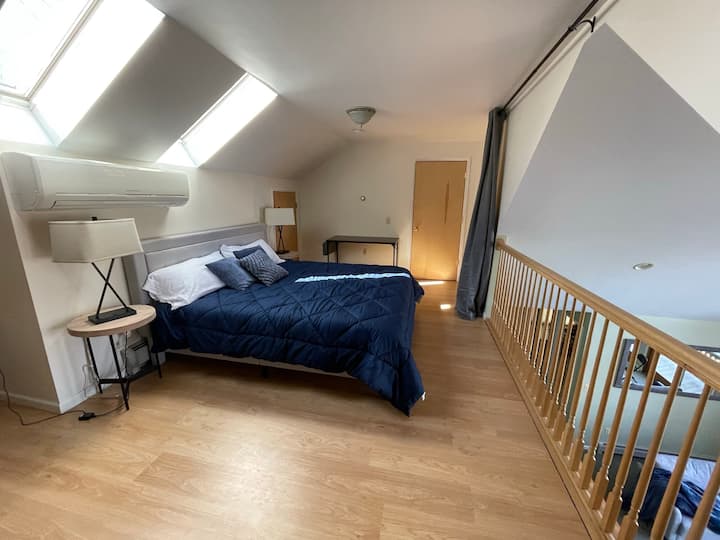Enjoy your own space with a king size bed in upstairs loft with privacy curtain