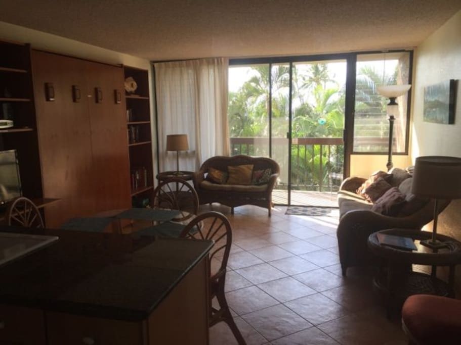 living room and kitchen with quiet garden view