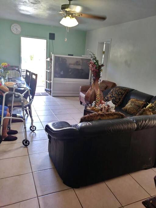 Common spaces are couch, a pool to sit by and a backyard for adults to walk in