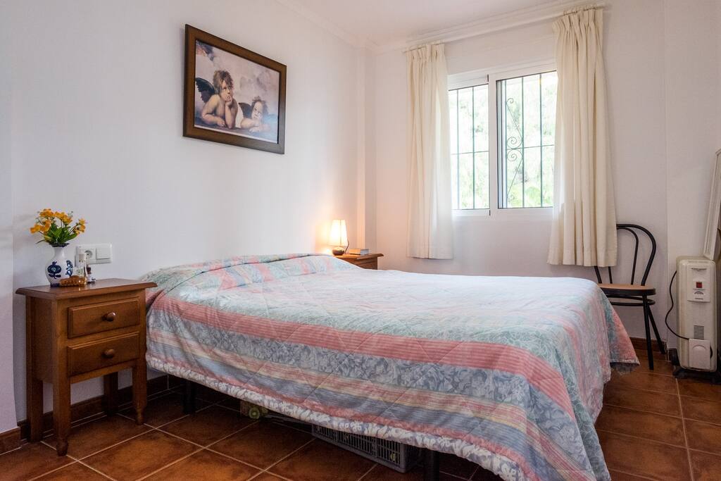 the master bedroom containing fitted wardrobes and external window to the walkway to the entrance door - the apartment is semi-detached so no one walks by and also there are no buildings behind the apartment