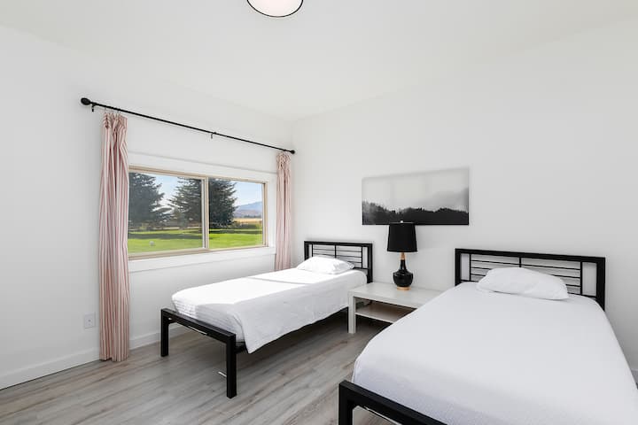 This bedroom also houses the washer and dryer.