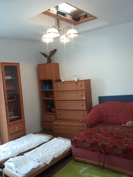 main room with 1 double bed and 2 kids beds