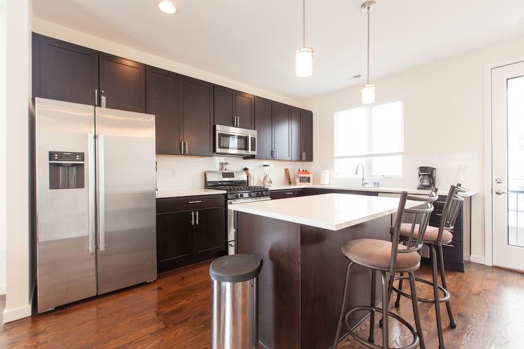 Gourmet kitchen with brand new high-end appliances.