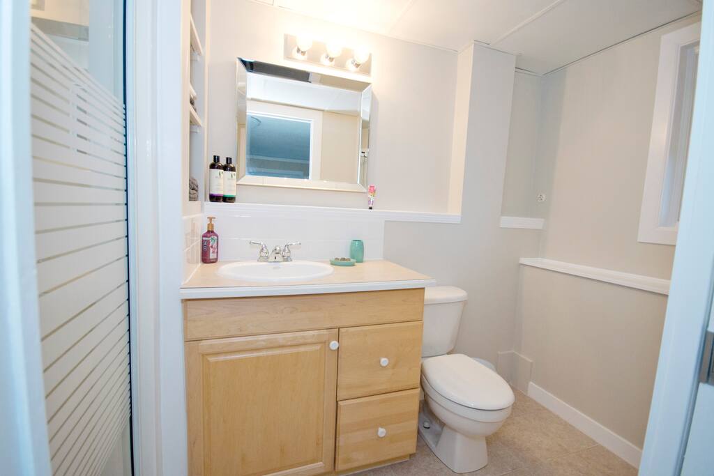 Ensuite bathroom. Single shower with Rain Shower head. Shampoo, conditioner, and soap provided. Hair dryer for use as well.