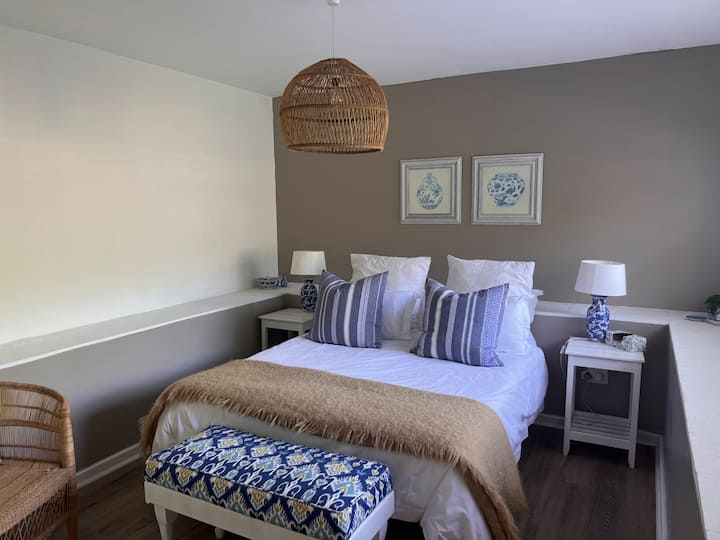 Downstairs bedroom with queen bed and en-suite bathroom