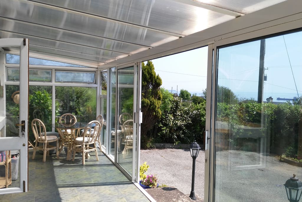 Large front conservatory, provides two seating areas for alternative sociable spaces for chatting and enjoying the view or morning yoga, exercise or reading whatever takes your fancy.