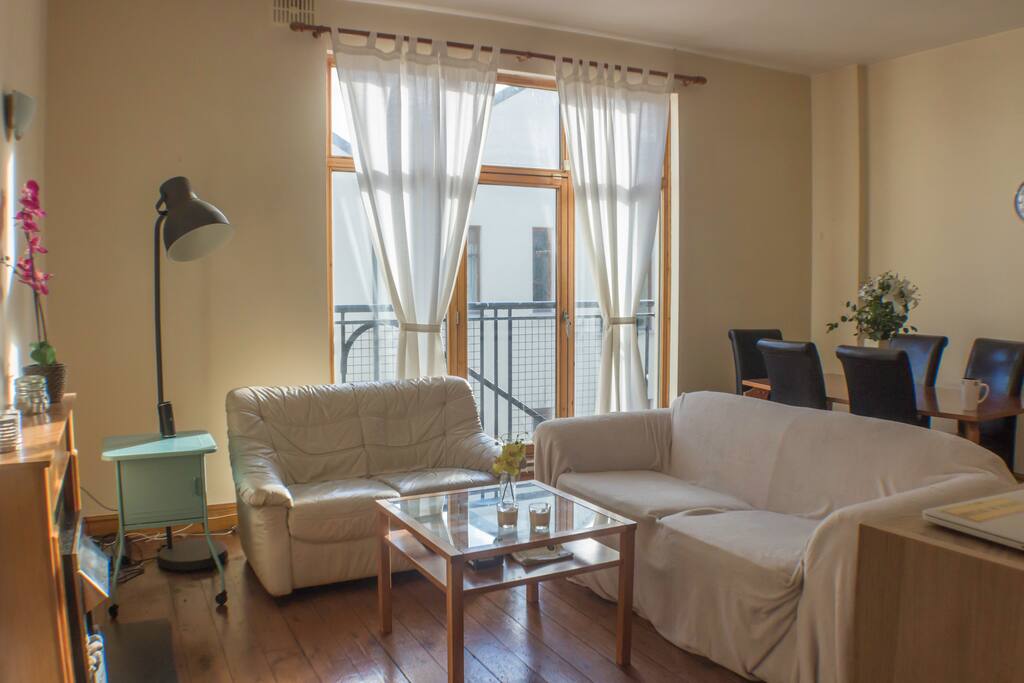 Two comfortable sofas and a high-end dinning table for 6 people