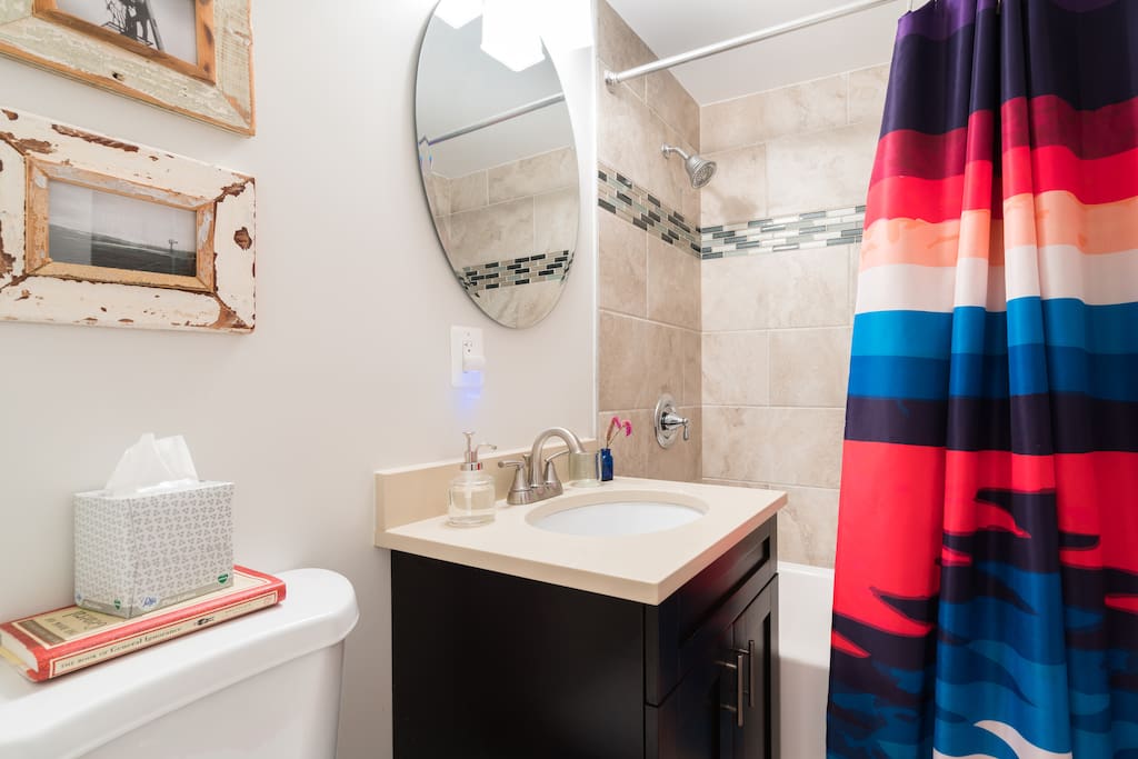 Our colorful bathroom offers a shower with robust water pressure.