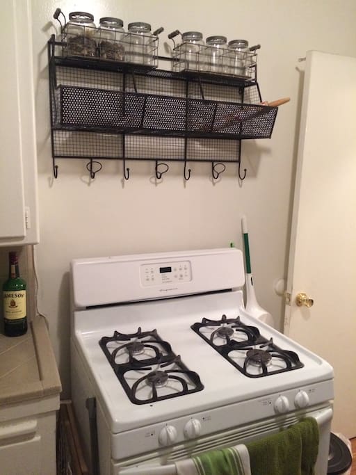Cozy kitchen has stove, coffee maker, pots, pans, cups, small fridge/freezer, and anything you need to feel right at home.