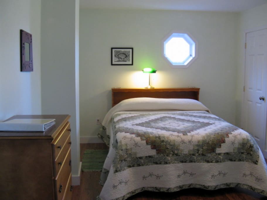 Room with queen size bed.