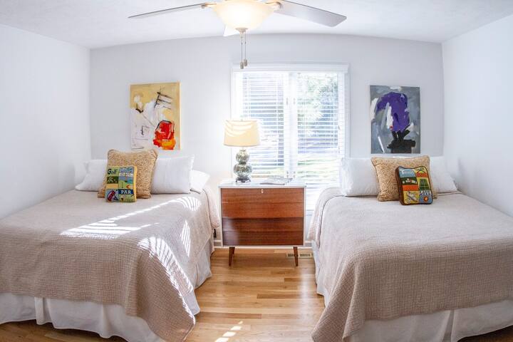 The Franklin Room features two (2) all new queen pillow top beds