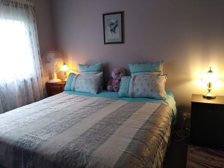 The rear bedroom with a very comfy king size bed .