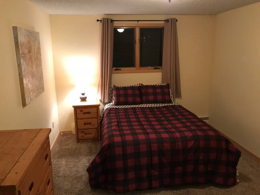 Bedroom 2 features a queen bed, closet and a 6 drawer dresser