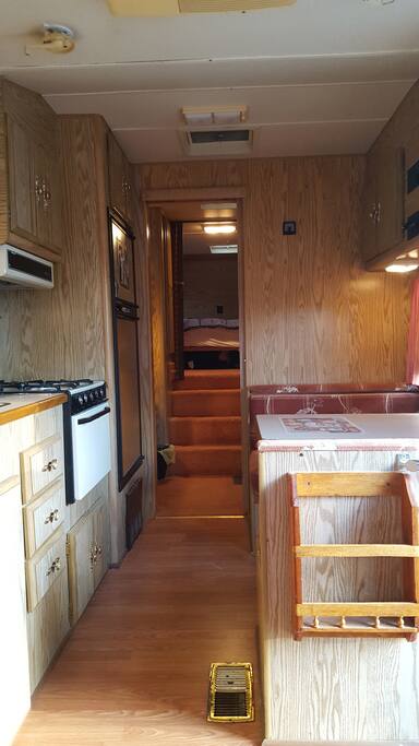 Entry way through kitchen and hallway to bedroom.