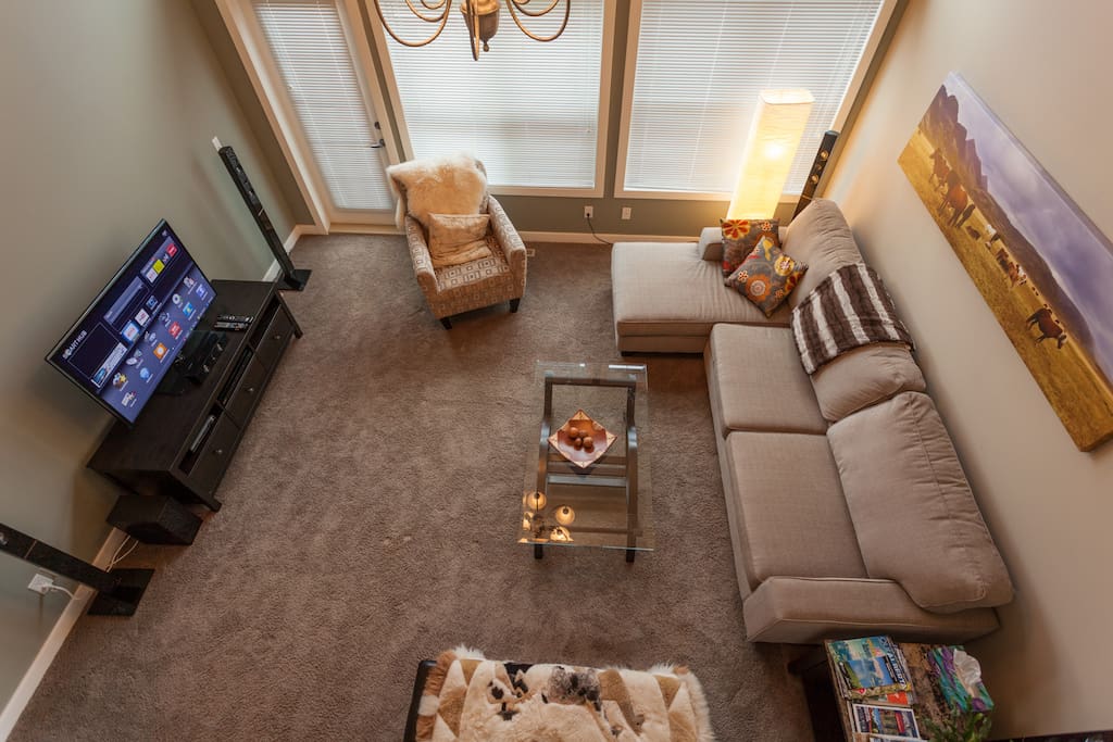 Living Room from stairway. Door to deck on the left.