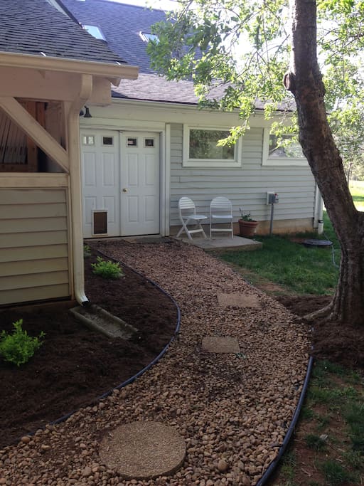 Entry door & seating under an apple tree