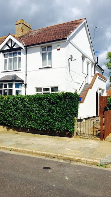 Shows access to flat via external stairs to front door.