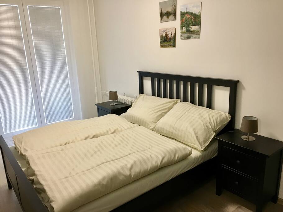 Bedroom 1 with balcony and double bed.