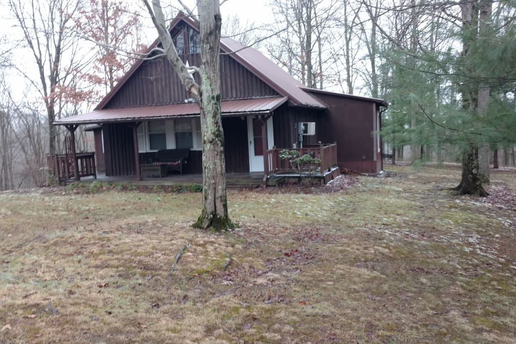 Classic A-Frame cabin nestled in the woods.