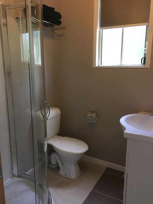 Own bathroom with small shower, toilet, basin. Towels and soap provided