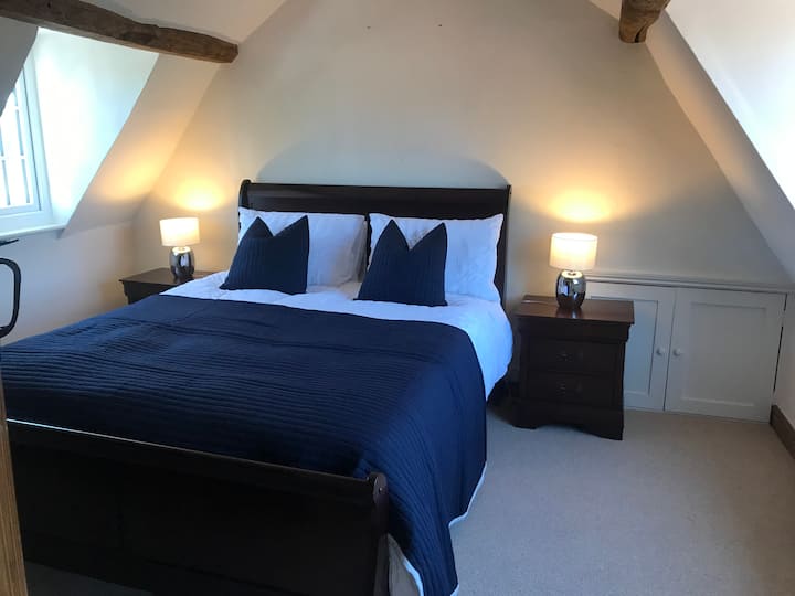 Master bedroom with king size bed and50 inch TV