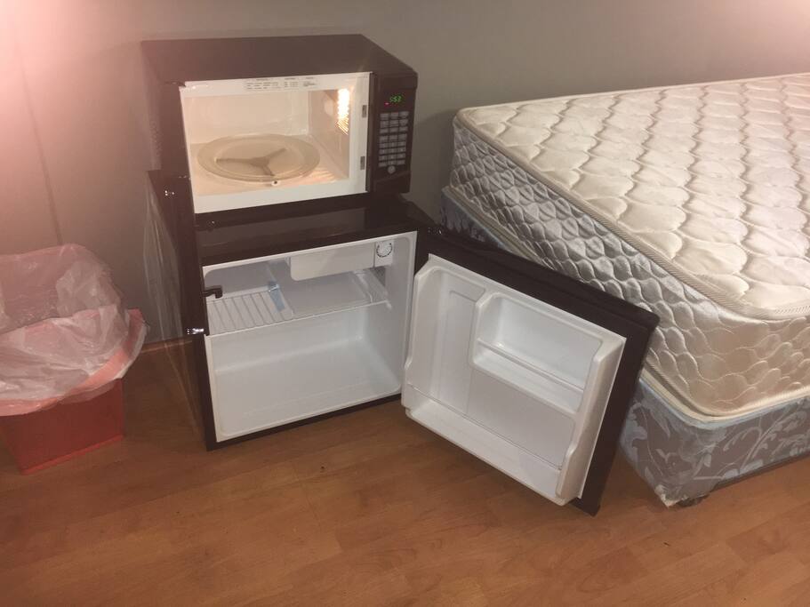 Dorm-fridge and microwave in the room. Full kitchen outside.