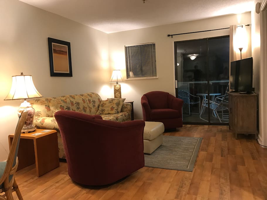 Living Area with queen size pullout. Sliding door to screened in porch.