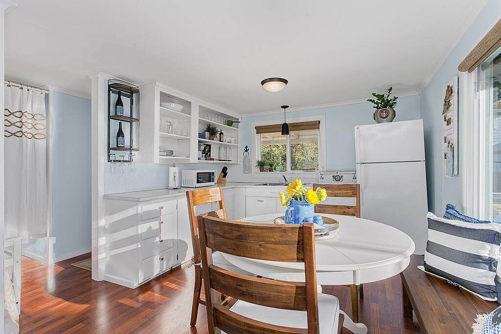 The L-shaped kitchen includes all the essentials for making a snack or meal