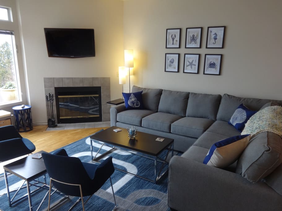 Living room includes sofa sleeper, cable tv and more.