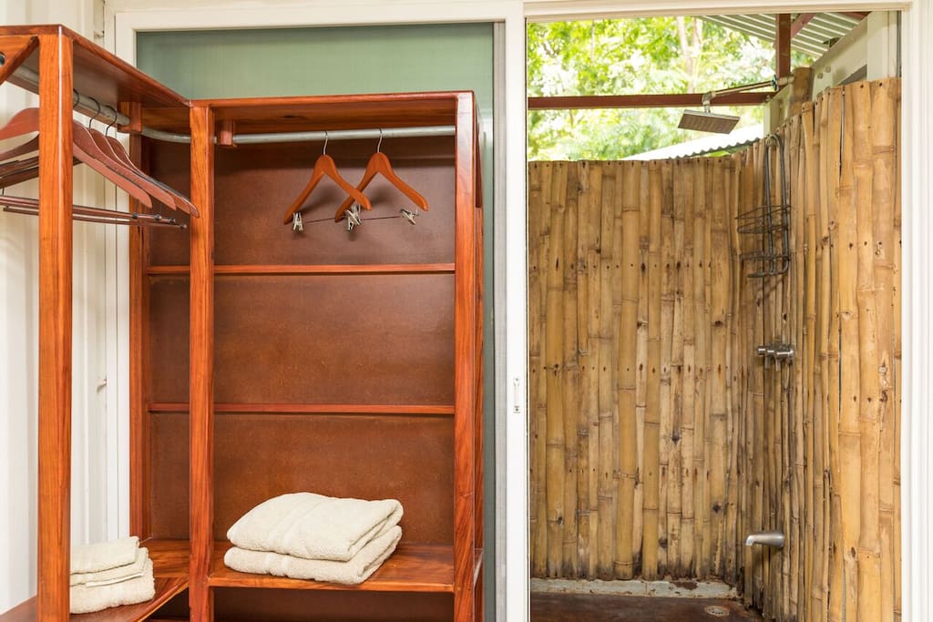 Your private out door shower. 24hr hot water and fresh towels. Space to store your clothes.