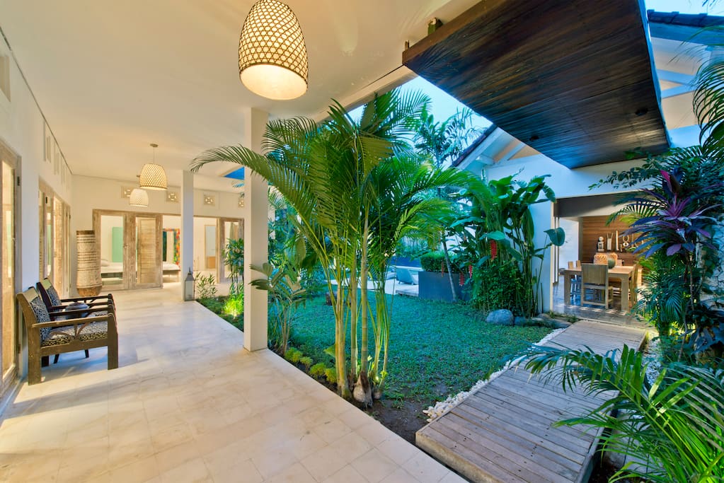 Outoor corridor leading to indoor leaving room and bedrooms