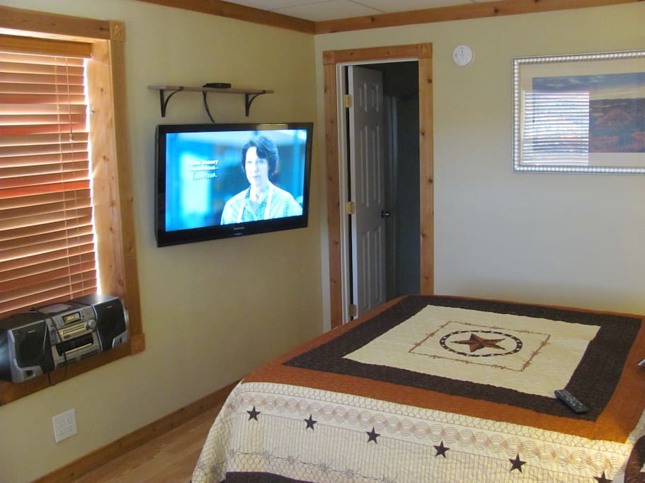 Large 40 inch wall mounted TV with Cable TV. Wifi also provided.