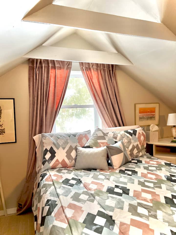 The loft bedroom features a queen bed and the option to dress a built-in lounge bed with twin bedding. *Parents please note the loft features a lockable door at the bottom of the stairs. 