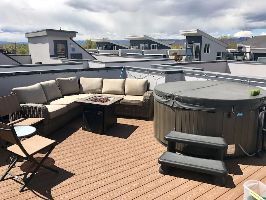 Rooftop deck with fireplace and hot tub