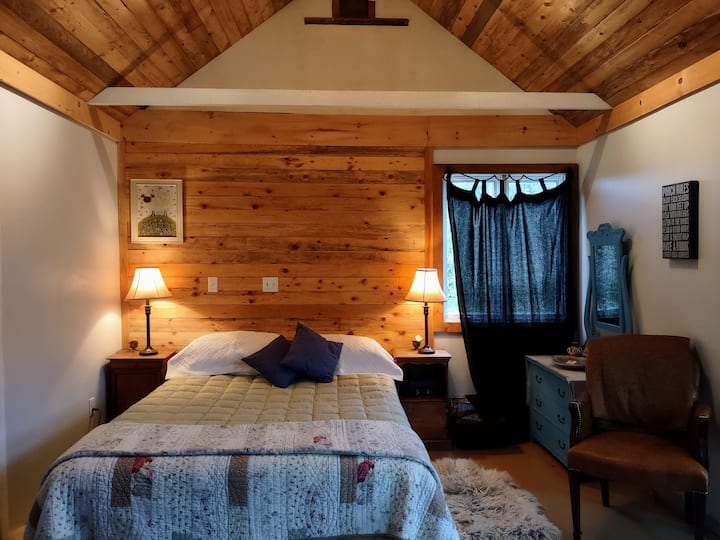Hand crafted local larch barn board, feather down duvets, sheepskin rugs, antique furnishings & special attention to details like black out curtains for that deep rejuvenating slumber