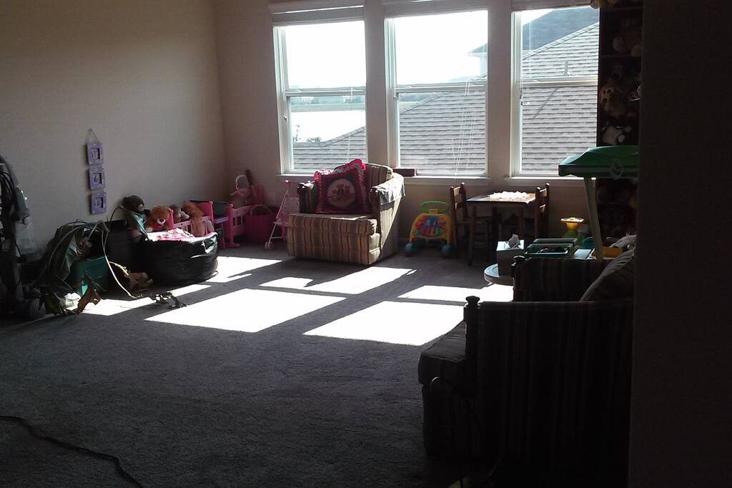 Shared living area has lots of toys for the kids.