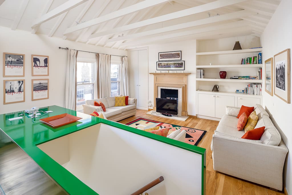 Splashes of green in the open-plan area add character to the space.
