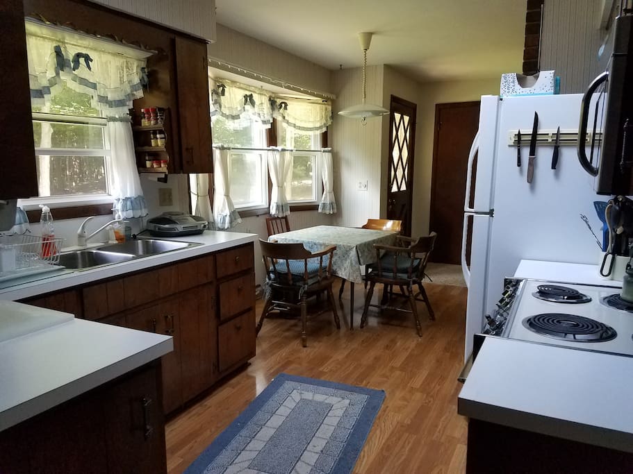 The kitchen is fully appointed with dishes, pots, pans, oven, stove, microwave -- everything you would expect in a summer cottage.