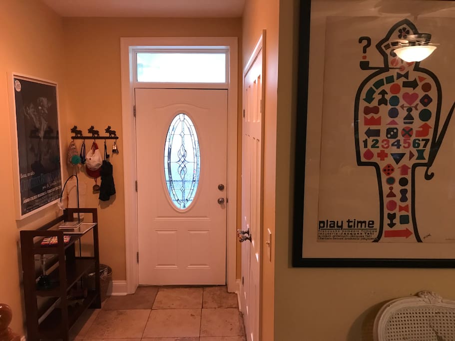 Entryway with coat closet.